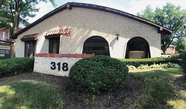 Exterior view of Park Ridge Dental Associates white brick building