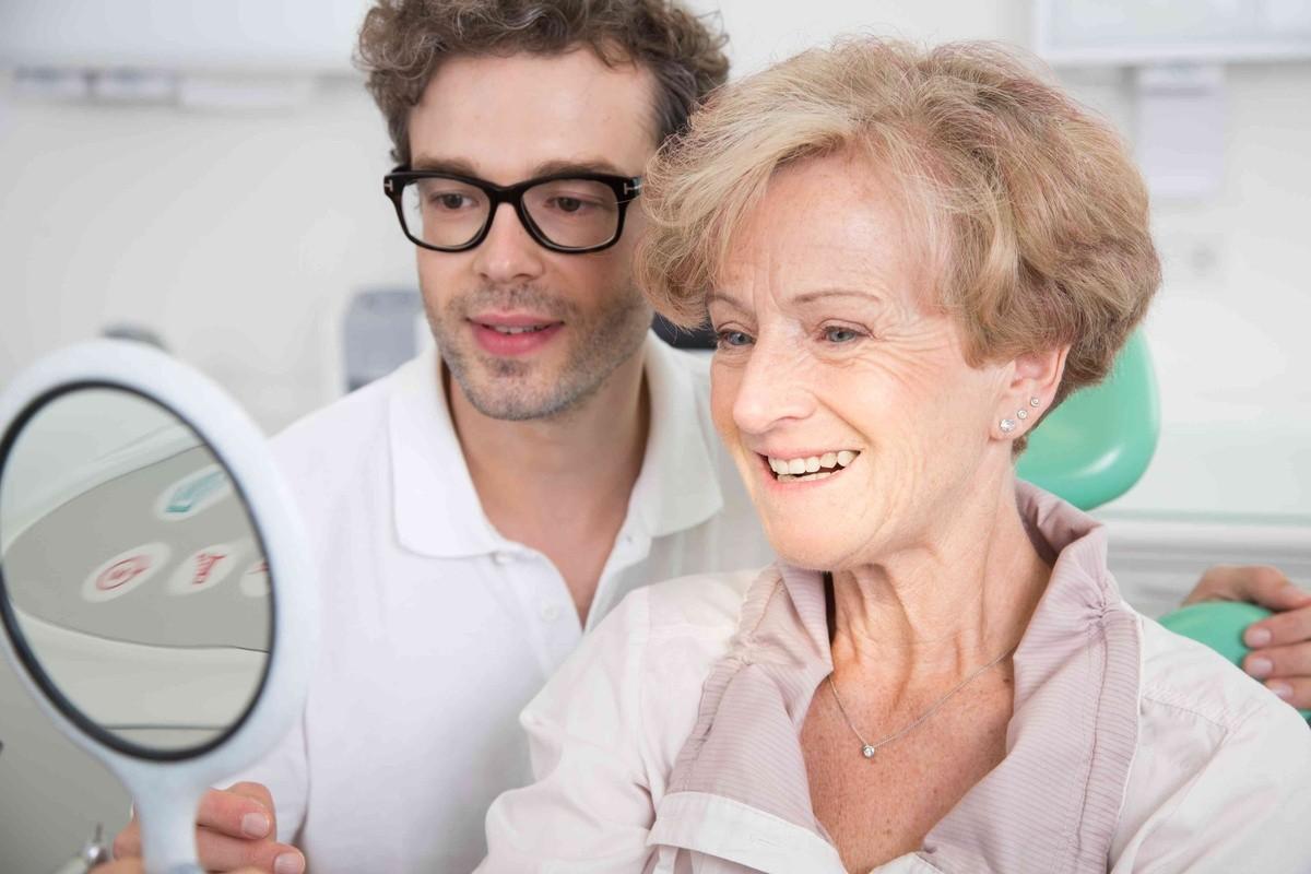 Dentist discussing dental veneers with a patient during a smile consultation